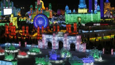People visit ice sculptures illuminated by coloured lights during the opening day of the 31st Harbin International Ice and Snow Festival in the northern city of Harbin, Heilongjiang province. The annual Ice and Snow Festival, organised by China National Tourism Administration. Kim Kyung-Hoon / Reuters