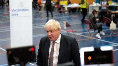Britain's Prime Minister Boris Johnson speaks to the media as he visits a Covid-19 vaccination centre at Little Venice Sports Centre in London. AFP
