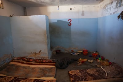 Mattresses and food are strewn across at the empty cells at Shaddadi prison. Reuters