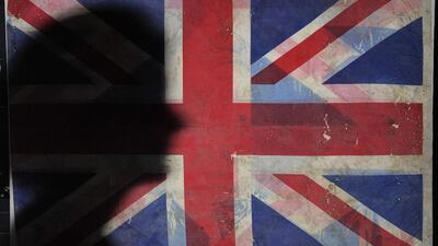 The shadow of an employee of the Imperial War Museum in Manchester falls onto a Union Flag recovered from the wreckage of the World Trade Center in New York following the 2001 attacks. The flag will form part of an exhibition marking the 10th anniversary of 9/11. The show will run for two years. Nigel Roddis / Reuters