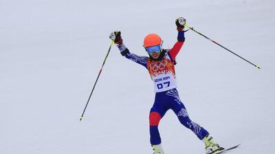 Thailand's Vanessa Vanakorn reacts after crossing the finish line in the women's Alpine skiing giant slalom at the Sochi Winter Olympics on February 18, 2014. Alexander Klein / AFP