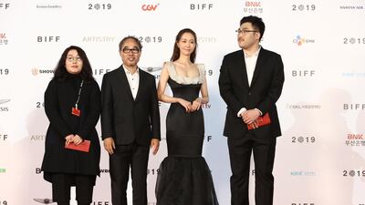 Actress Yoo Young and actor Kang Shin-il arrive for the Opening Ceremony of the 24th Busan International Film Festival. Getty Images