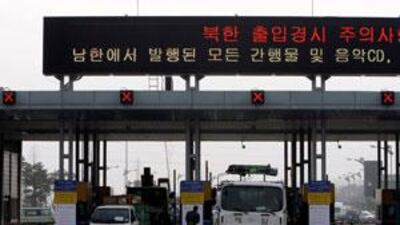 South Korean vehicles arrive at the Inter-Korean Transit Office in Paju, South Korea, near North Korea's border city of Kaesong, on on March 16, 2009. Three days after shutting down the border, North Korea agreed to partially reopen the crossing.
