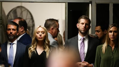 Eric Trump, Donald Trump Jr and the former president's daughter-in-law, Lara Trump, arrive at the court. Reuters