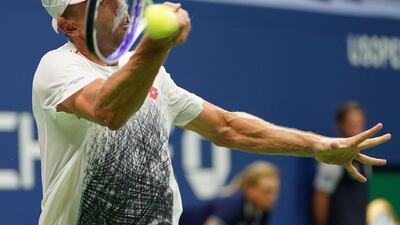 Millman hits a return to Djokovic. AFP