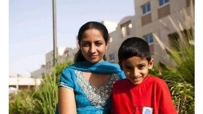 Shamna Krishnan, a librarian at Abu Dhabi Women's College, rises as early as 5.50am each morning to cook wholesome meals so her son, Navneets, 6, can reap the benefits of a healthy diet during the school day. Andrew Henderson / The National