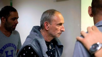 Israelis Eyal Shaty (C) and More Zohar (L), alleged members of a prostitution network, are pictured before a hearing at a court in Medellin, Colombia on December 10, 2018. AFP