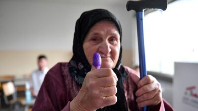 A Lebanese woman shows her ink-marked thumb after voting in Shmustar, Bekaa valley. EPA