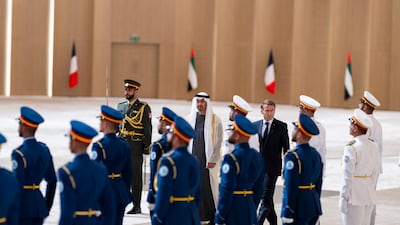 Sheikh Mohamed and Mr Macron inspect a UAE honour guard. UAE Presidential Court