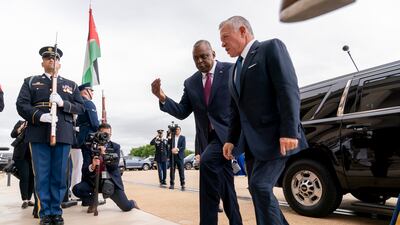US Secretary of Defence Lloyd Austin greets King Abdullah II of Jordan. AP