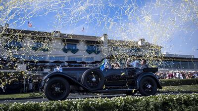 Confetti falls a 1931 Bentley 8 litre Gurney Nutting Sport Tourer. Bloomberg