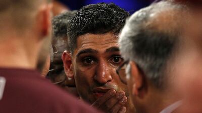 Amir Khan after suffering his sixth-round knockout to Saul "Canelo" Alvarez. Andrew Couldridge / Reuters