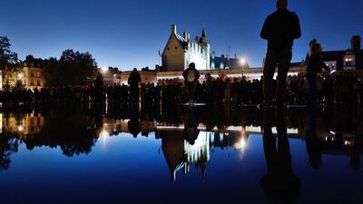 People walk on the water mirror on the esplanade of the Chateau des Ducs in Nantes, western France, during its inauguration. Jean-Sebastien Evrard / AFP