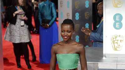 Lupita Nyong'o, wearing Dior, arrives at the British Academy Film Awards on February 16, 2014. EPA
