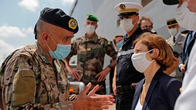 French Defence Minister Florence Parly speaks with a Lebanese army brigadier general upon disembarking from the French Navy amphibious assault helicopter carrier Tonnerre at Beirut port on August 14, 2020. AFP