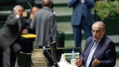 Iranian Economy and Finance Minister Masoud Karbasian (R) speaks to defend himself during an impeachment session at the Iranian Parliament in Tehran. EPA