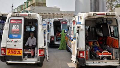 Patients with breathing problems wait in ambulances outside an Indian hospital in 2021. Doctors in Maharashtra have faced criticism over the death of 18 patients. Reuters