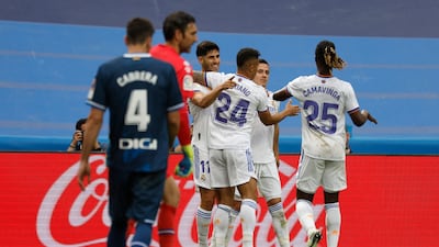Marco Asensio celebrates scoring their third goal with Mariano Diaz, Eduardo Camavinga and teammates. Reuters