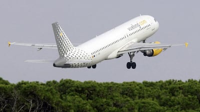 A Vueling aircraft takes off at Barcelona airport in Spain. Josep Lago / EPA