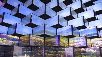 A woman cleans an installation of television sets at the booth of Vestel at the IFA in Berlin, one of Europe’s biggest showcases of the latest electronic gadgets. Tobias Schwarz / AFP