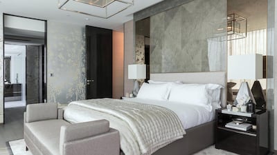 Much of the design has to do with the flow of the space, so the exquisite hand-painted silver wallpaper by Fromental in the bedroom suite extends into the dressing room beyond, which in turn links to the bathroom beyond. Antonie Robertson/The National