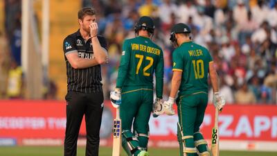 New Zealand's Jimmy Neesham , left, reacts after South Africa's Rassi Van Der Dussen hit six. AP