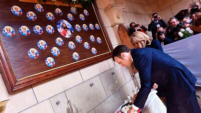 French President Emmanuel Macron, centre, and his wife Brigitte Macron, right, laying a wreath at the St Peter and St Paul's Church, that was targeted by an attack in 2016, during his visit at the Coptic Cathedral complex in Cairo, Egypt. EPA