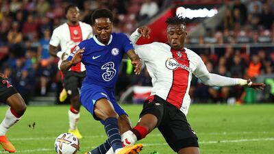 Soccer Football - Premier League - Southampton v Chelsea - St Mary's Stadium, Southampton, Britain - August 30, 2022 Chelsea's Raheem Sterling in action with Southampton's Armel Bella-Kotchap REUTERS/David Klein EDITORIAL USE ONLY. No use with unauthorized audio, video, data, fixture lists, club/league logos or 'live' services. Online in-match use limited to 75 images, no video emulation. No use in betting, games or single club /league/player publications. Please contact your account representative for further details.