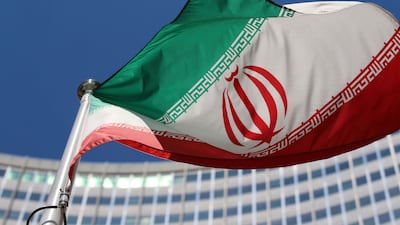 The Iranian flag flies in front of a UN building in Vienna. AP