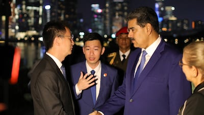 Venezuela's President Nicolas Maduro shaking hands with Secretary of the Nanshan District Committee of Shenzhen City Huang Xiangyue during a welcoming ceremony in Shenzhen, China on September 9. Miraflores Palace Press Office/AFP