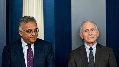Dr Ashish Jha and Dr Anthony Fauci attend the daily press briefing at the White House in Washington. AFP