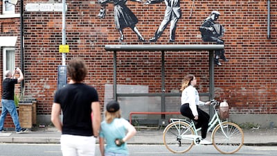 This artwork depicting people dancing above a bus stop in Great Yarmouth is already attracting the attention of passers-by.