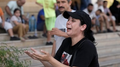 A woman reacts to the news of the death of Hezbollah leader Hassan Nasrallah in Beirut. AP