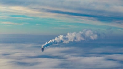Steam rising from a chimney shrouded in a blanket of fog on an autumn morning in Warsaw, Poland. AFP