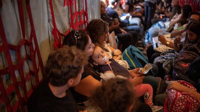 Greeks and Greek-Cypriots on board a Hellenic Air Force C130 being evacuated from Lebanon. Reuters