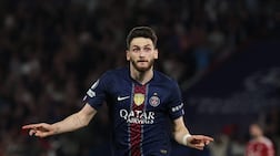 Paris Saint-Germain's Georgian forward #07 Khvicha Kvaratskhelia celebrates scoring his team's second goal during the UEFA Champions League quarter-final first leg football match between Paris Saint-Germain (PSG) and Liverpool FC at the Parc des Princes stadium in Paris on April 8, 2026. (Photo by Anne-Christine POUJOULAT / AFP)