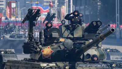 Korean People's Army (KPA) soldiers stand atop armoured vehicles during a military parade on Kim Il Sung square in Pyongyang. AFP