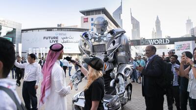 A robot interacts with visitors at Gitex Technology Week in 2018. Reem Mohammed / The National