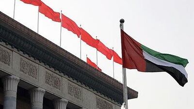The flag of the United Arab Emirates flies outside the Great Hall of the People in Beijing. Trade between the UAE and China has accelerated at a rapid rate in recent years. Ryan Carter / The National