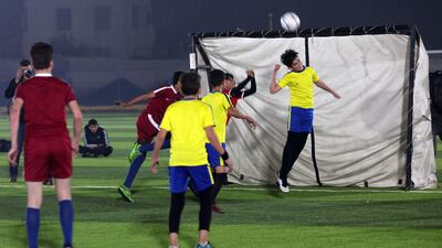 Children representing Qatar and Ecuador in action