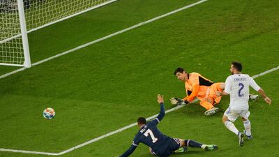 Real Madrid goalkeeper Thibaut Courtois saves from Paris St Germain's Kylian Mbappe during their Champions League Last 16 first leg clash in Paris. AFP