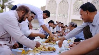 Worshippers break their fast before the evening prayer at the Sheikh Mohammed Bin Zayed Mosque in the capital. Antonie Robertson / The National