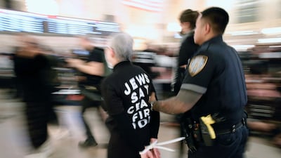 Some of the protesters wore t-shirts with the slogan 'Jews say ceasefire now' and 'Not in our name'. AFP