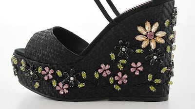 La Silla channels a 1970s attitude with a jet black woven wedge, adorned with sparkling crystal flowers. Courtesy La Silla