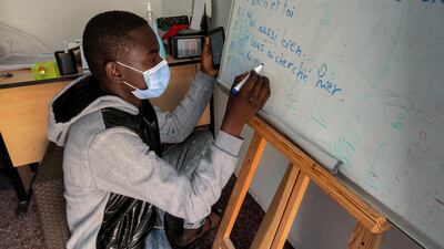A migrant learns French at a centre run by the Organisation for the Support of Migrants, in the southern Tunisian city of Medenine.