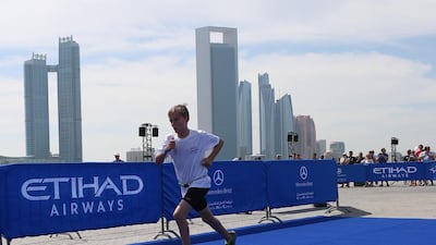 A boy runs during the race. Hundreds of children from ages five to 15 participated on Friday.
