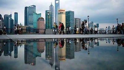 China has eased restrictions on investments in lenders, paving the way for the entry of UAE banks. Above, Shanghai's financial district. Philippe Lopez / AFP