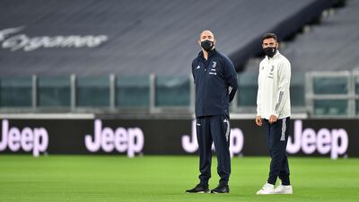 Juventus staff out on the pitch prior to the match against Napoli. EPA