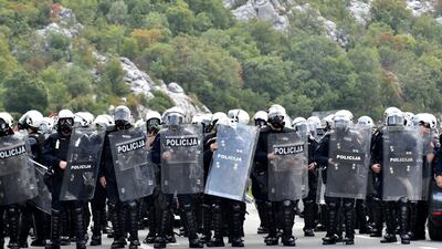 Montenegro riot police guard a road near Cetinje. AP Photo