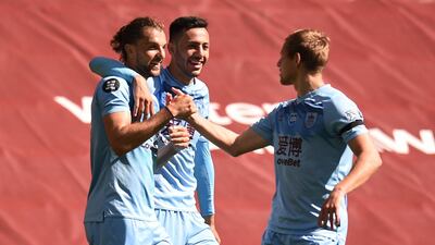 Burnley's Jay Rodriguez celebrates scoring their first goal with Dwight McNeil and Matej Vydra. Reuters